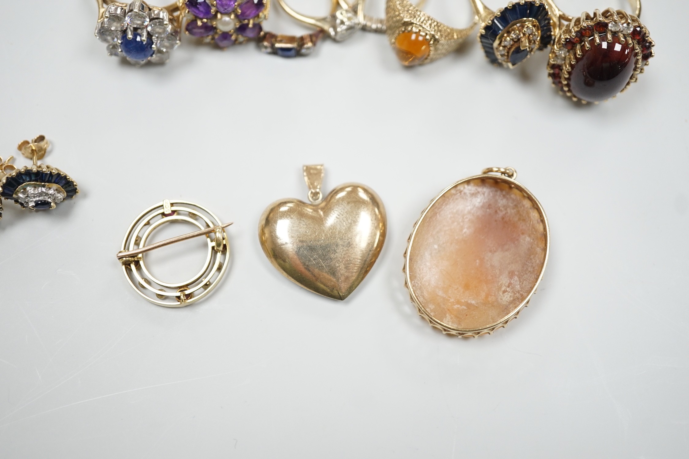 Eight assorted mainly modern 9ct gold and gem set dress rings, including amethyst and split pearl cluster, gross weight 30.7 grams, a 15ct, ruby and seed pearl set open work circular brooch, gross 2.6 grams, pair of 9ct,